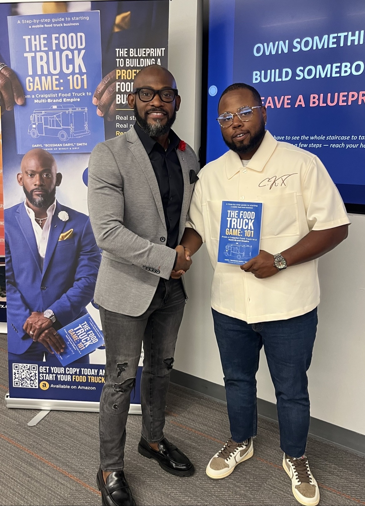 Reader holding The Food Truck Game: 101 with Bossman Daryl