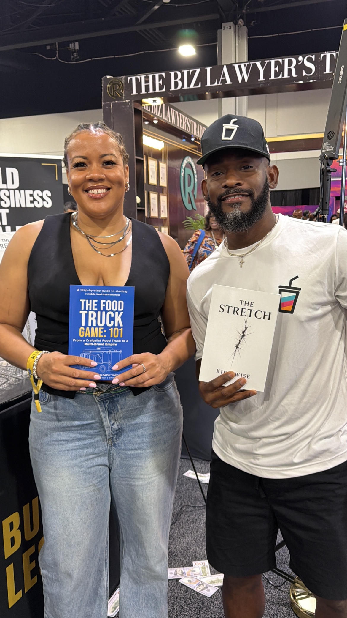 Reader with The Food Truck Game: 101 alongside Bossman Daryl holding The Stretch by Kika Wise