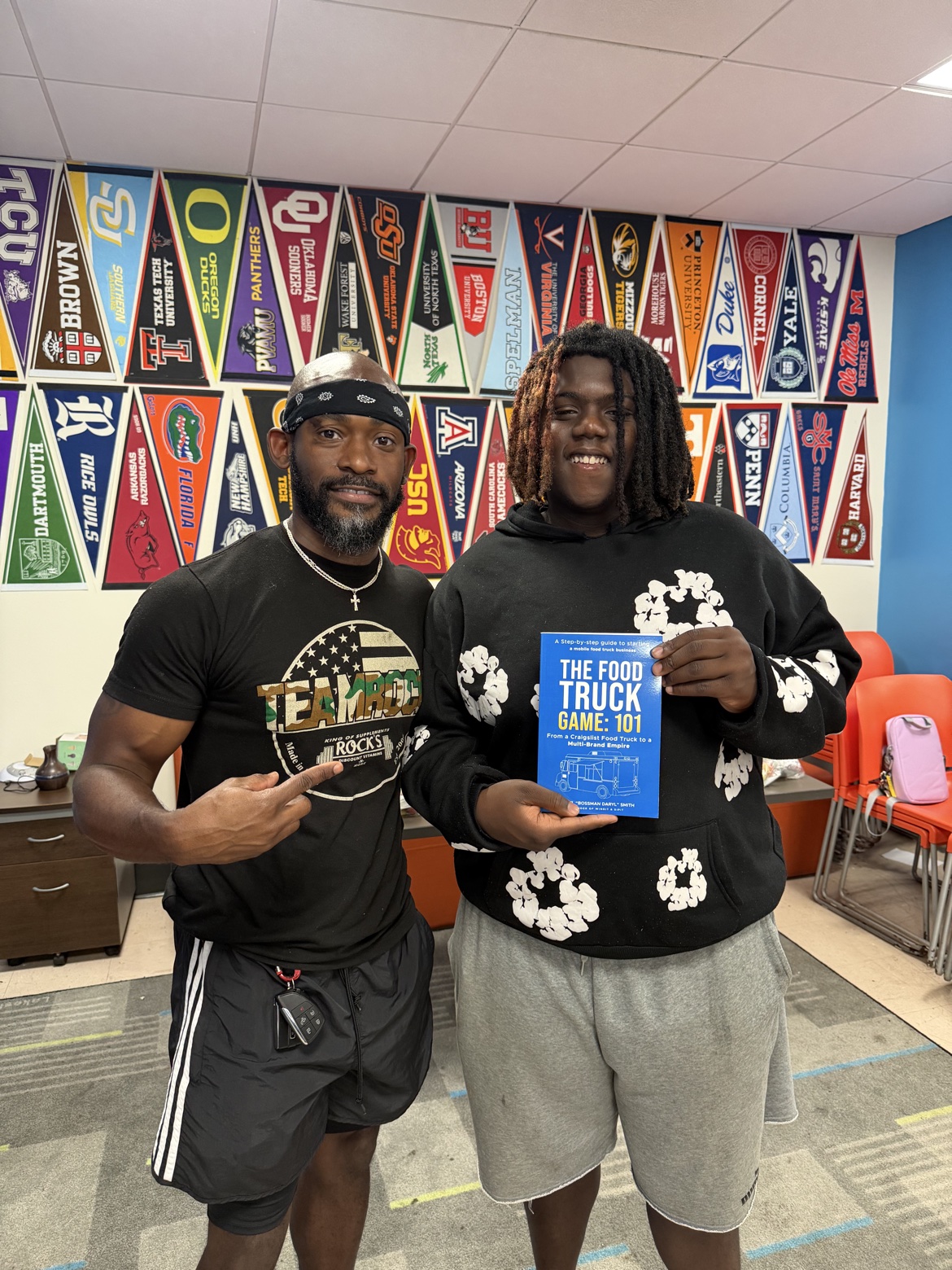 Young reader holding The Food Truck Game: 101 with Bossman Daryl