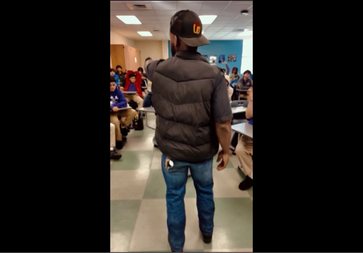Bossman Daryl teaching in a classroom